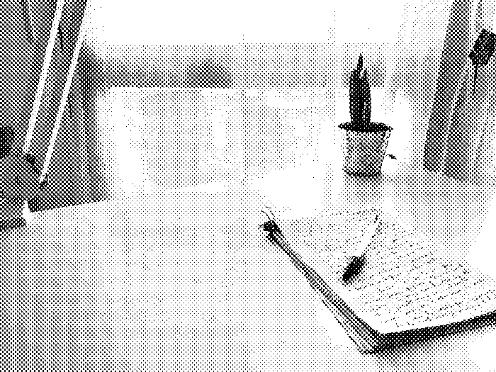 &ldquo;A Bic pen lying on stack of scrap paper on which a few lines of text is handwritten&rdquo;